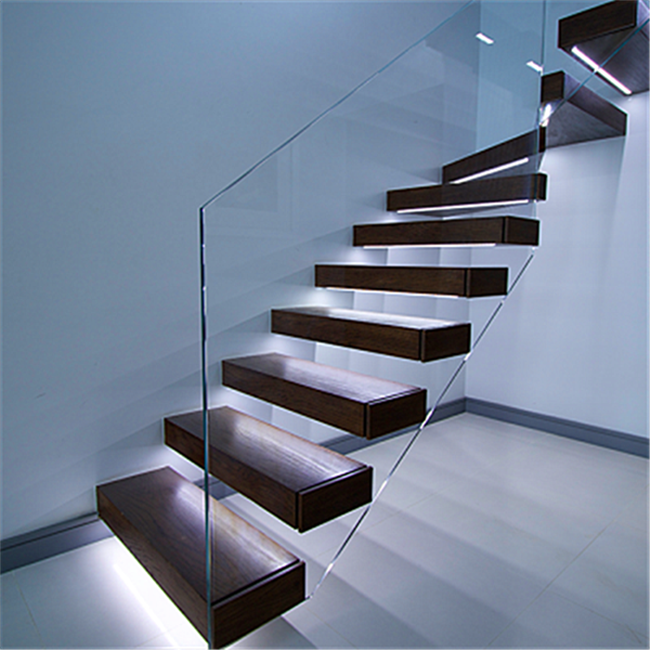 Interior staircase with Led wood tread and glass railing